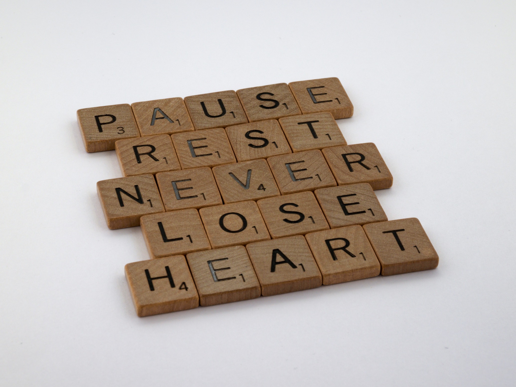 "Pause, Rest, Never Lose Heart" in scrabble blocks